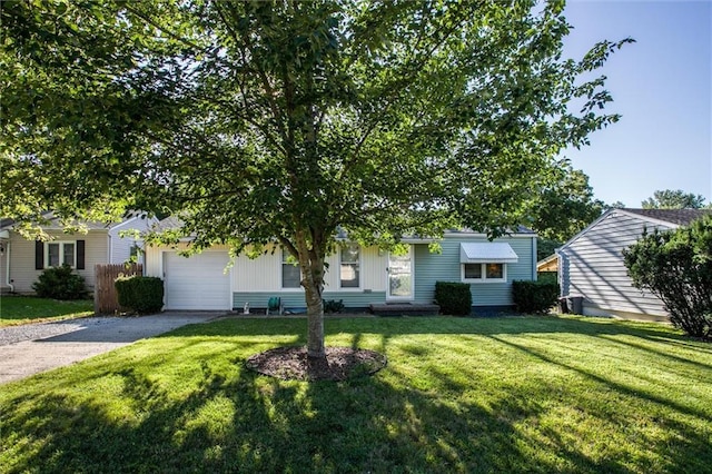 3021 Appleton Ave, Independence, MO 64052 - view of front facade with driveway, an attached garage, and a front yard