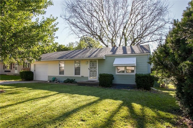 3021 Appleton Ave, Independence, MO 64052 - view of front of home featuring an attached garage, a front lawn, and driveway