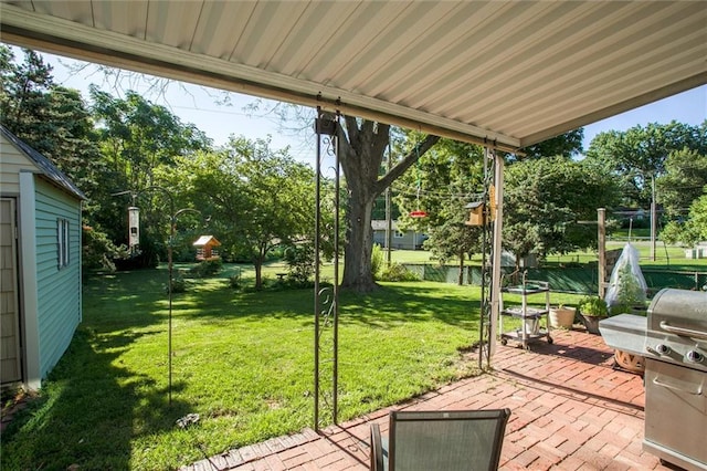 3021 Appleton Ave, Independence, MO 64052 - wooden deck featuring a patio, a lawn, and grilling area