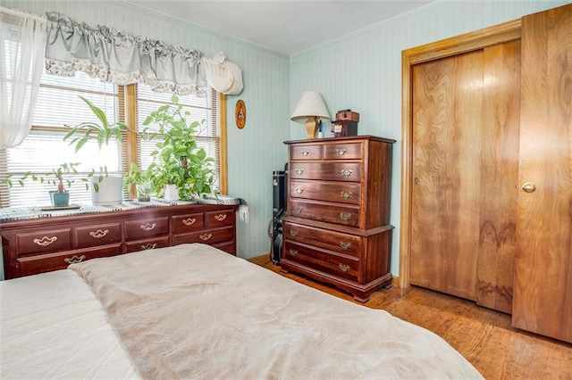 3021 Appleton Ave, Independence, MO 64052 - bedroom with crown molding, wood finished floors, and a closet