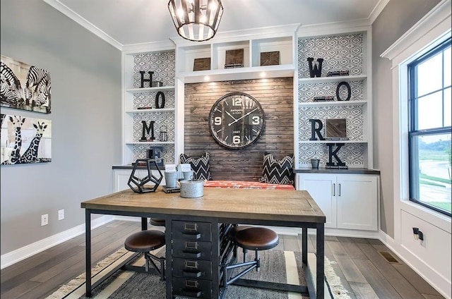 3409 W 187th St, Overland Park, KS 66085 - home office with ornamental molding, dark wood-style flooring, plenty of natural light, a chandelier, and built in features