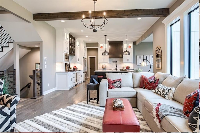 3409 W 187th St, Overland Park, KS 66085 - living room featuring wood finished floors, beamed ceiling, recessed lighting, stairs, and beverage cooler