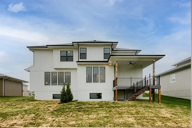 3409 W 187th St, Overland Park, KS 66085 - back of property with ceiling fan, stairs, and a lawn