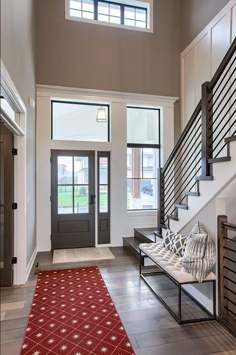 3409 W 187th St, Overland Park, KS 66085 - entryway with a towering ceiling, wood finished floors, and stairway