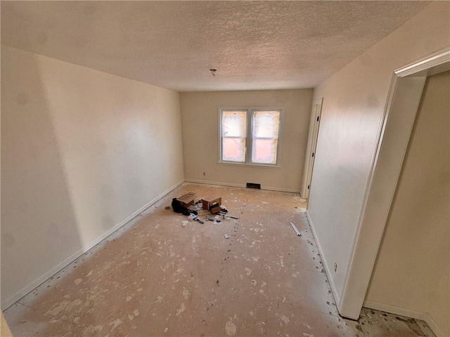 3649 S Park Ave, Independence, MO 64052 - unfurnished room featuring a textured ceiling and baseboards