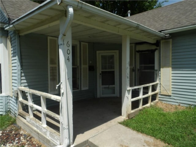 604 S Lexington St, Holden, MO 64040 - view of exterior entry featuring a shingled roof
