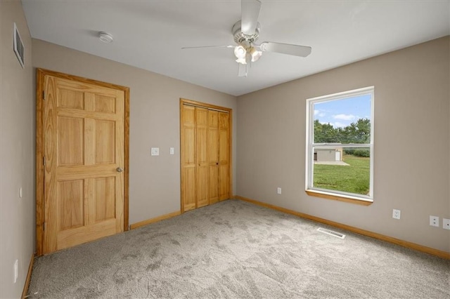 295 E 2300th Rd, Edgerton, KS 66021 - unfurnished bedroom with carpet floors, a closet, and a ceiling fan