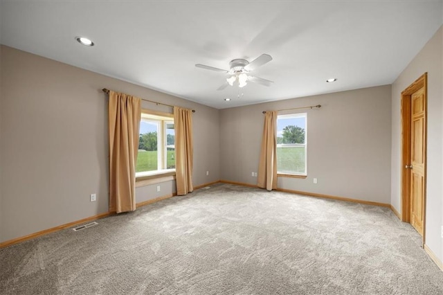 295 E 2300th Rd, Edgerton, KS 66021 - unfurnished room featuring healthy amount of natural light, a ceiling fan, light carpet, and recessed lighting