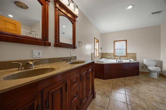 295 E 2300th Rd, Edgerton, KS 66021 - bathroom featuring a bath, double vanity, vaulted ceiling, tile patterned floors, and recessed lighting