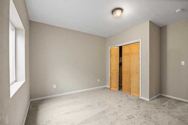295 E 2300th Rd, Edgerton, KS 66021 - unfurnished bedroom featuring carpet and a closet
