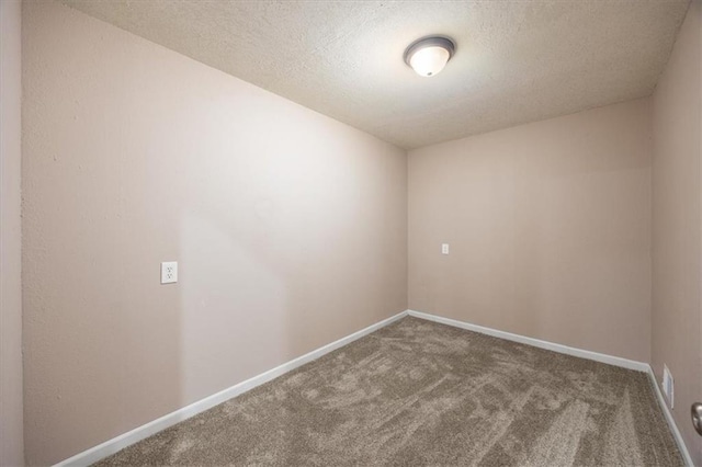 295 E 2300th Rd, Edgerton, KS 66021 - carpeted spare room with baseboards and a textured ceiling