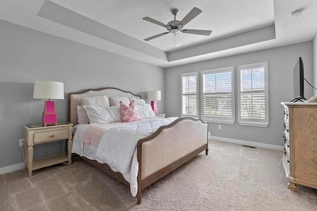 3726 SW Walsh Dr, Lees Summit, MO 64082 - bedroom with a raised ceiling, light colored carpet, and ceiling fan