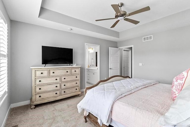 3726 SW Walsh Dr, Lees Summit, MO 64082 - bedroom with light colored carpet, a tray ceiling, a ceiling fan, and ensuite bathroom
