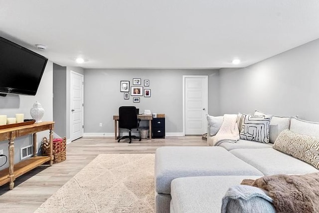 3726 SW Walsh Dr, Lees Summit, MO 64082 - living room featuring a desk, light wood-style flooring, and recessed lighting