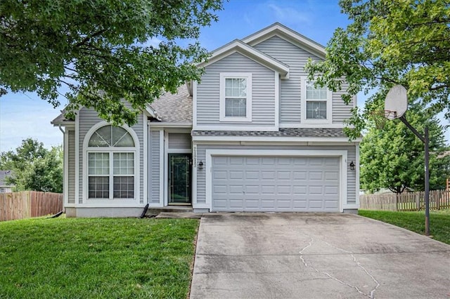 21213 W 51st Ter, Shawnee, KS 66218 - traditional home featuring concrete driveway, a garage, and roof with shingles