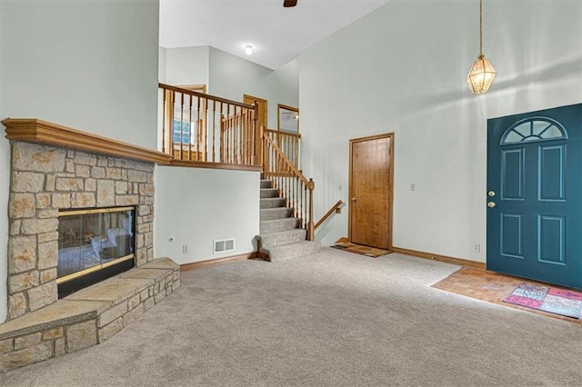 21213 W 51st Ter, Shawnee, KS 66218 - carpeted foyer with high vaulted ceiling, stairway, and a fireplace