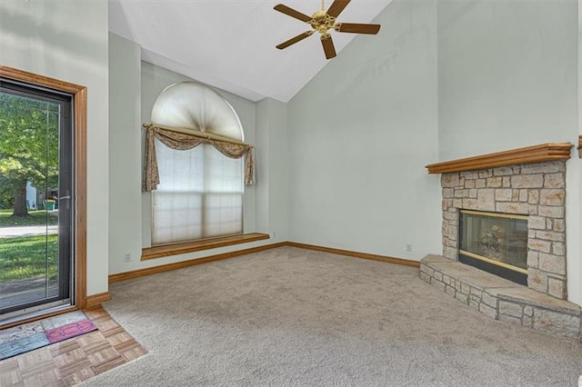 21213 W 51st Ter, Shawnee, KS 66218 - unfurnished living room with high vaulted ceiling, ceiling fan, a fireplace, and carpet flooring