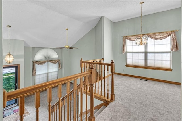 21213 W 51st Ter, Shawnee, KS 66218 - corridor with an upstairs landing, carpet, plenty of natural light, a textured ceiling, and a chandelier