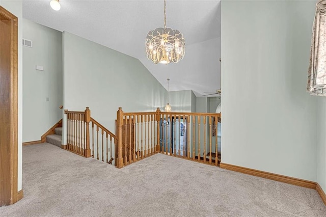 21213 W 51st Ter, Shawnee, KS 66218 - hallway featuring carpet flooring, a chandelier, lofted ceiling, and an upstairs landing