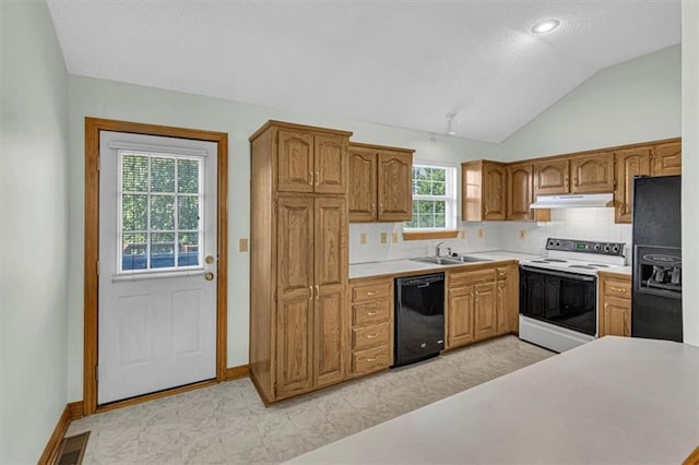 21213 W 51st Ter, Shawnee, KS 66218 - kitchen with black appliances, under cabinet range hood, lofted ceiling, light countertops, and tasteful backsplash
