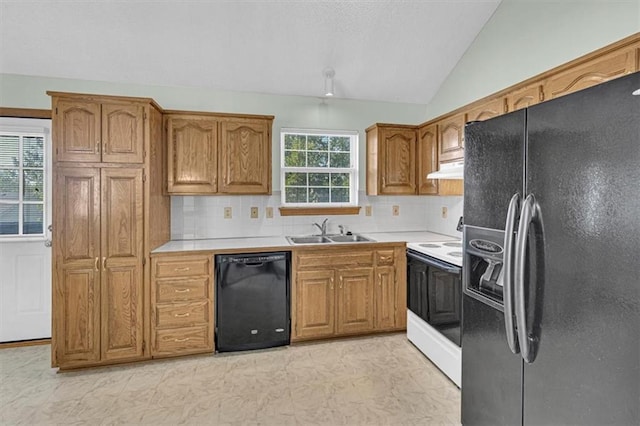 21213 W 51st Ter, Shawnee, KS 66218 - kitchen with black appliances, lofted ceiling, tasteful backsplash, and light countertops