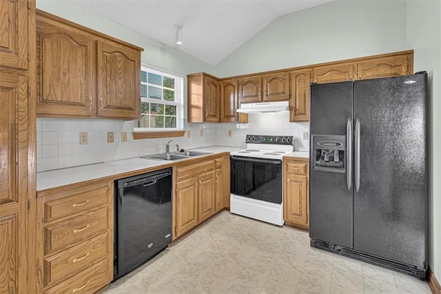 21213 W 51st Ter, Shawnee, KS 66218 - kitchen with black appliances, under cabinet range hood, lofted ceiling, light countertops, and brown cabinets