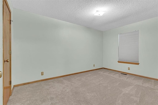 21213 W 51st Ter, Shawnee, KS 66218 - unfurnished room with light carpet and a textured ceiling