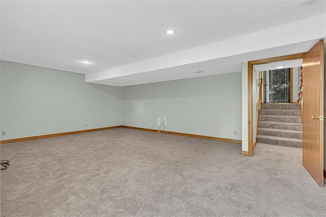 21213 W 51st Ter, Shawnee, KS 66218 - finished below grade area with carpet floors, a textured ceiling, stairs, and recessed lighting