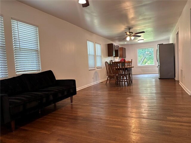 3009 N 33rd St, Kansas City, KS 66104 - dining area with a ceiling fan and dark wood-style floors