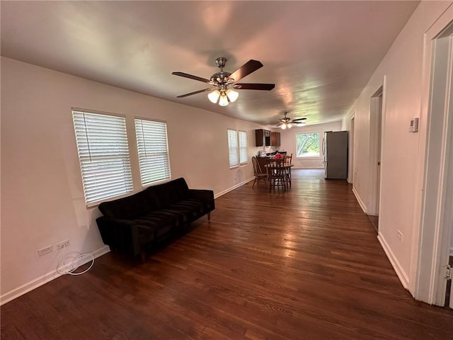 3009 N 33rd St, Kansas City, KS 66104 - living area featuring dark wood-style floors and ceiling fan