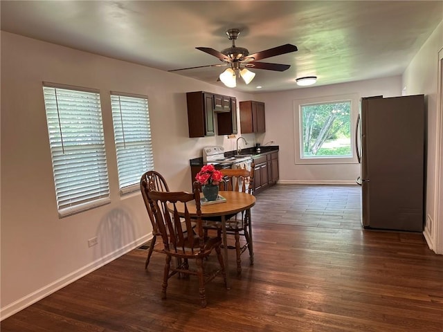 3009 N 33rd St, Kansas City, KS 66104 - dining area with dark wood-type flooring and a ceiling fan