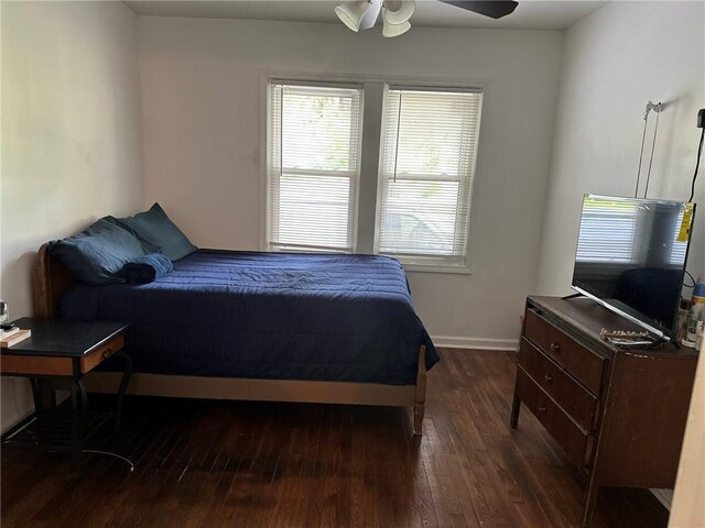 3009 N 33rd St, Kansas City, KS 66104 - bedroom featuring dark wood-style floors, multiple windows, and ceiling fan