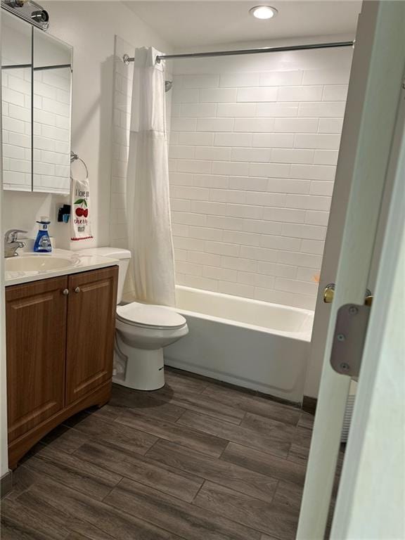 3009 N 33rd St, Kansas City, KS 66104 - full bath with vanity, shower / bath combination with curtain, wood finished floors, and recessed lighting