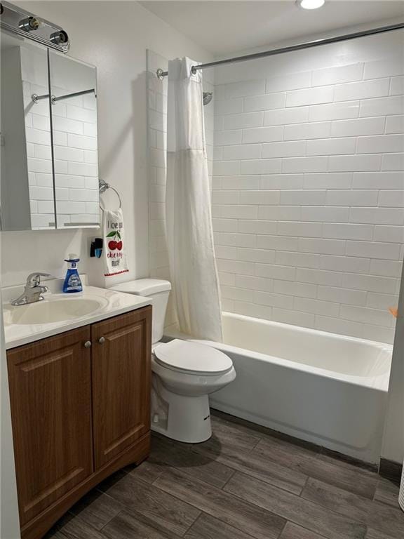 3009 N 33rd St, Kansas City, KS 66104 - bathroom featuring vanity, shower / tub combo, and wood tiled floors