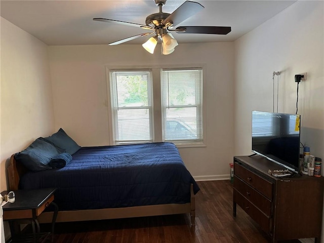 3009 N 33rd St, Kansas City, KS 66104 - bedroom with dark wood-style floors and ceiling fan