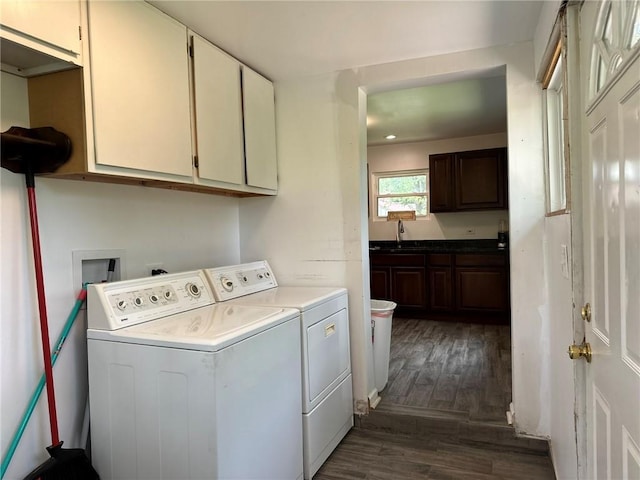 3009 N 33rd St, Kansas City, KS 66104 - laundry room featuring cabinet space, washing machine and dryer, and dark wood-type flooring