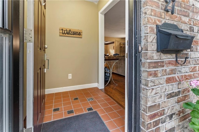 27 W Bannister Rd, Kansas City, MO 64114 - hall featuring tile patterned flooring and baseboards