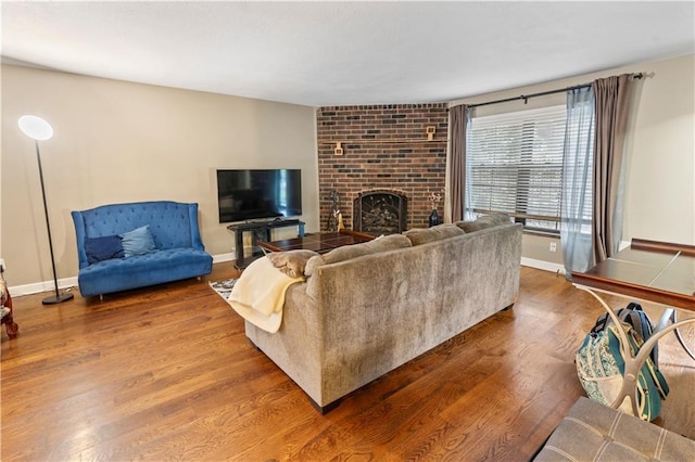 27 W Bannister Rd, Kansas City, MO 64114 - living room with wood finished floors and a fireplace