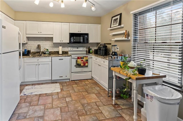 27 W Bannister Rd, Kansas City, MO 64114 - kitchen with white appliances, decorative backsplash, white cabinetry, and dark stone countertops