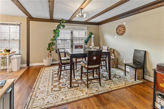 27 W Bannister Rd, Kansas City, MO 64114 - dining room with beamed ceiling, a chandelier, and wood finished floors