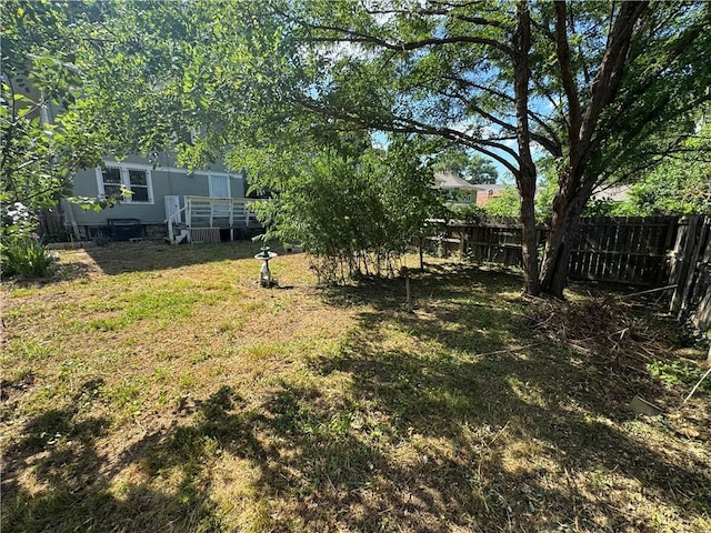 5647 Wayne Ave, Kansas City, MO 64110 - view of yard with a deck