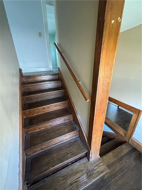 5647 Wayne Ave, Kansas City, MO 64110 - stairway with wood finished floors
