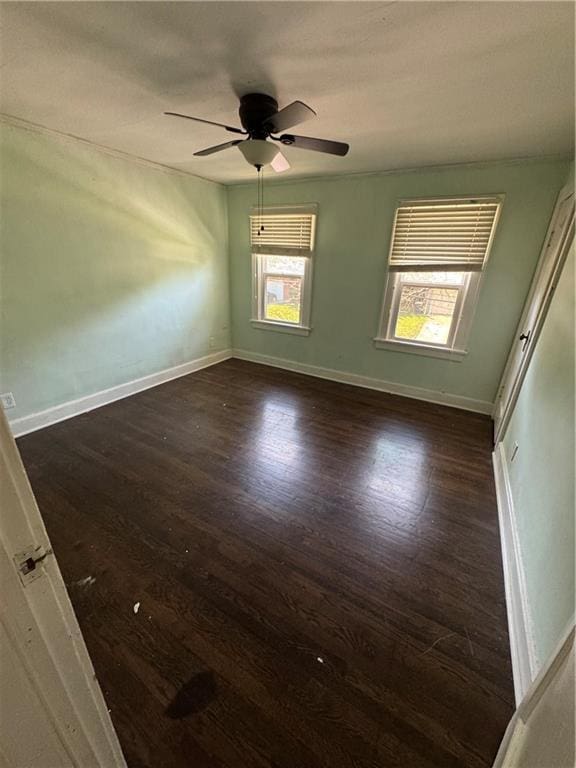 5647 Wayne Ave, Kansas City, MO 64110 - spare room with wood finished floors and ceiling fan