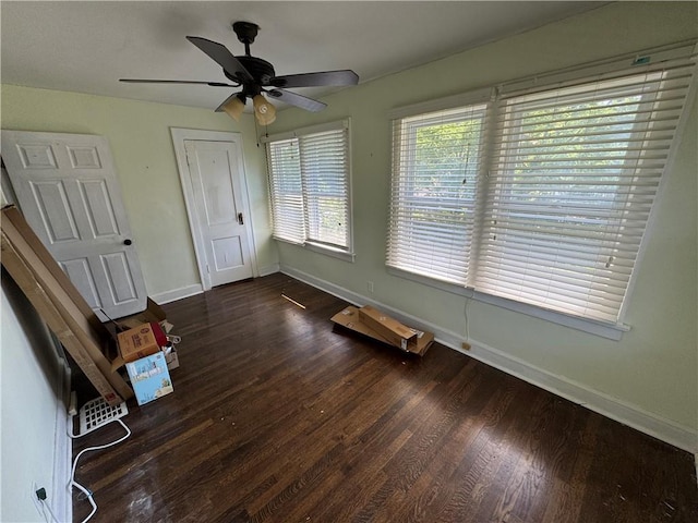 5647 Wayne Ave, Kansas City, MO 64110 - spare room featuring dark wood-style floors and a ceiling fan