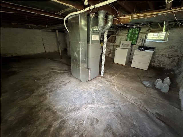 5647 Wayne Ave, Kansas City, MO 64110 - below grade area featuring independent washer and dryer and heating unit