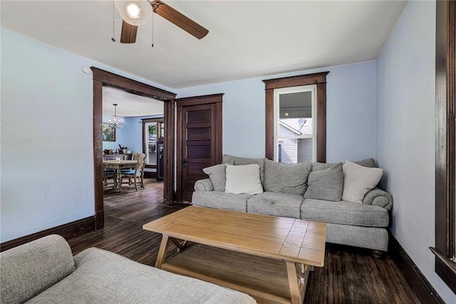 519 S Lincoln Ave, Chanute, KS 66720 - living area featuring a chandelier, dark wood-style floors, and ceiling fan