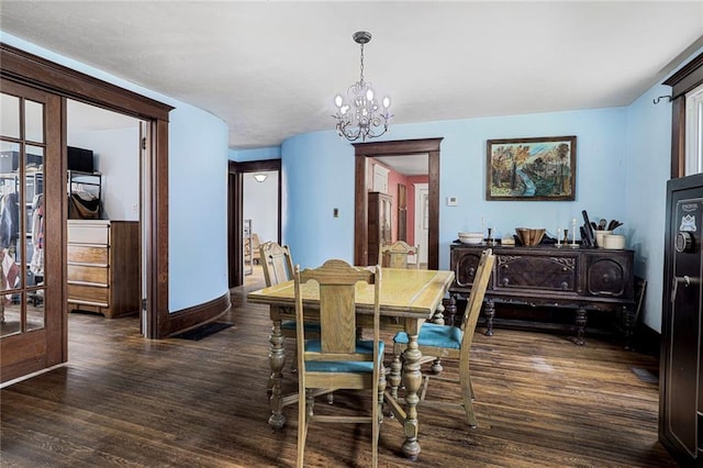 519 S Lincoln Ave, Chanute, KS 66720 - dining room with wood finished floors and a chandelier