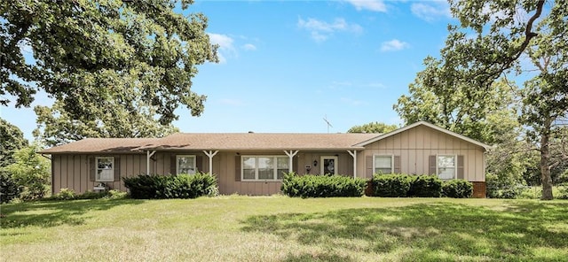 561 SW County Road O, Holden, MO 64040 - ranch-style home featuring board and batten siding and a front lawn