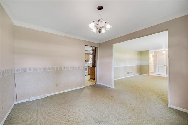 561 SW County Road O, Holden, MO 64040 - empty room with carpet flooring, a chandelier, and ornamental molding