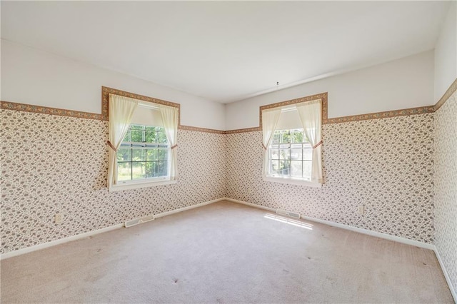 561 SW County Road O, Holden, MO 64040 - empty room featuring healthy amount of natural light, carpet flooring, and wallpapered walls